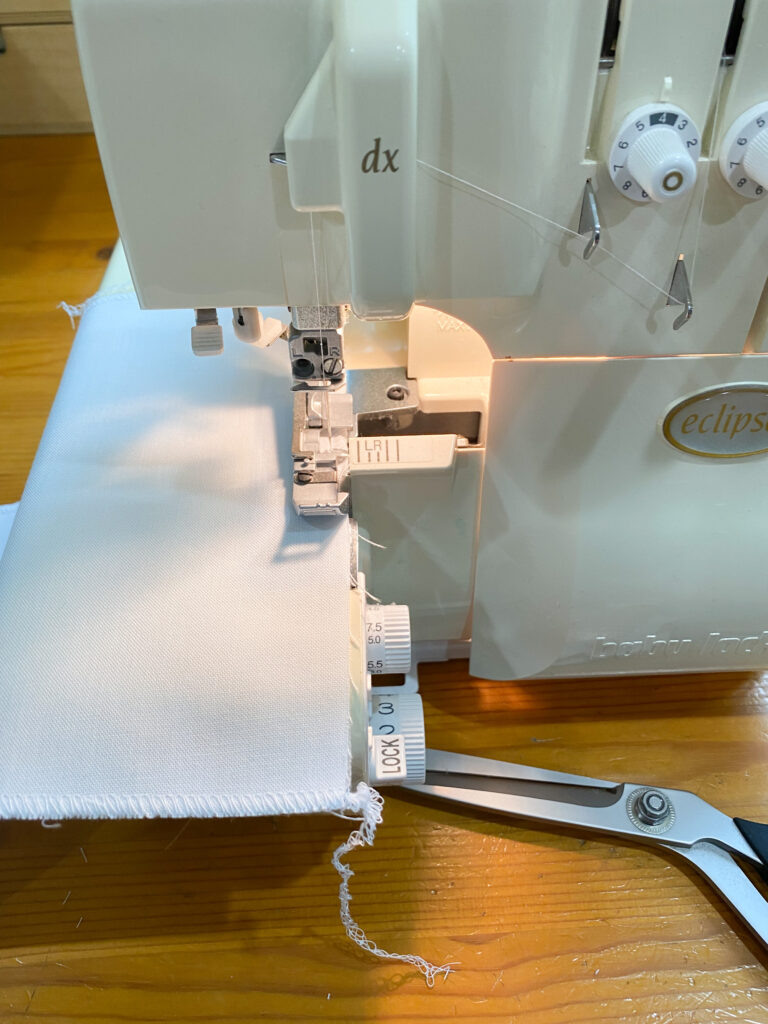 Zigzag stitching raw fabric edges to prevent fraying