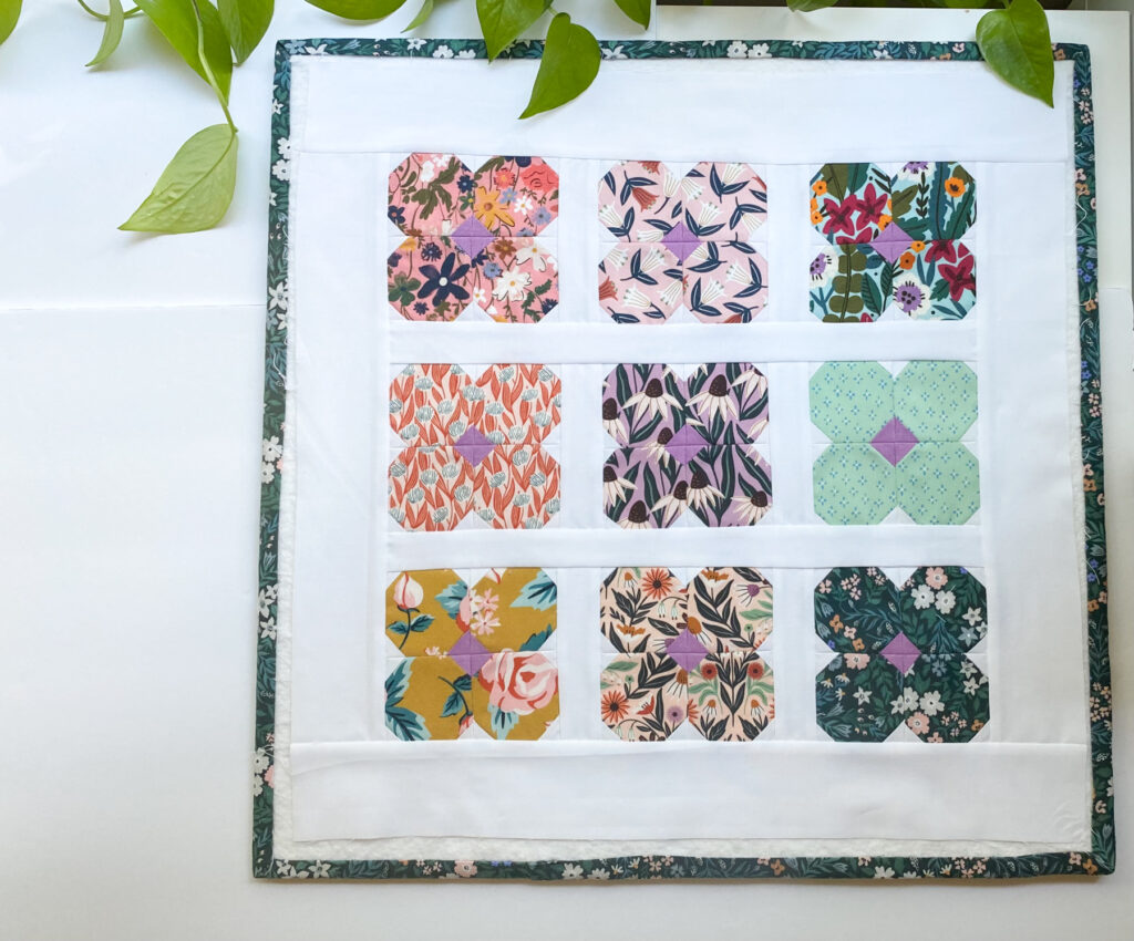 Placing blocks for the Blossom Pillow Pattern on a white background