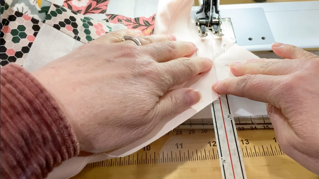 sewing line across the overlapped binding ends.