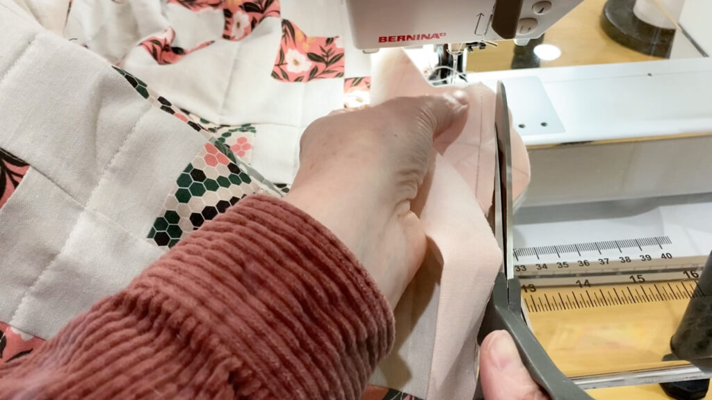 Trimming the binding seam to 1/4"