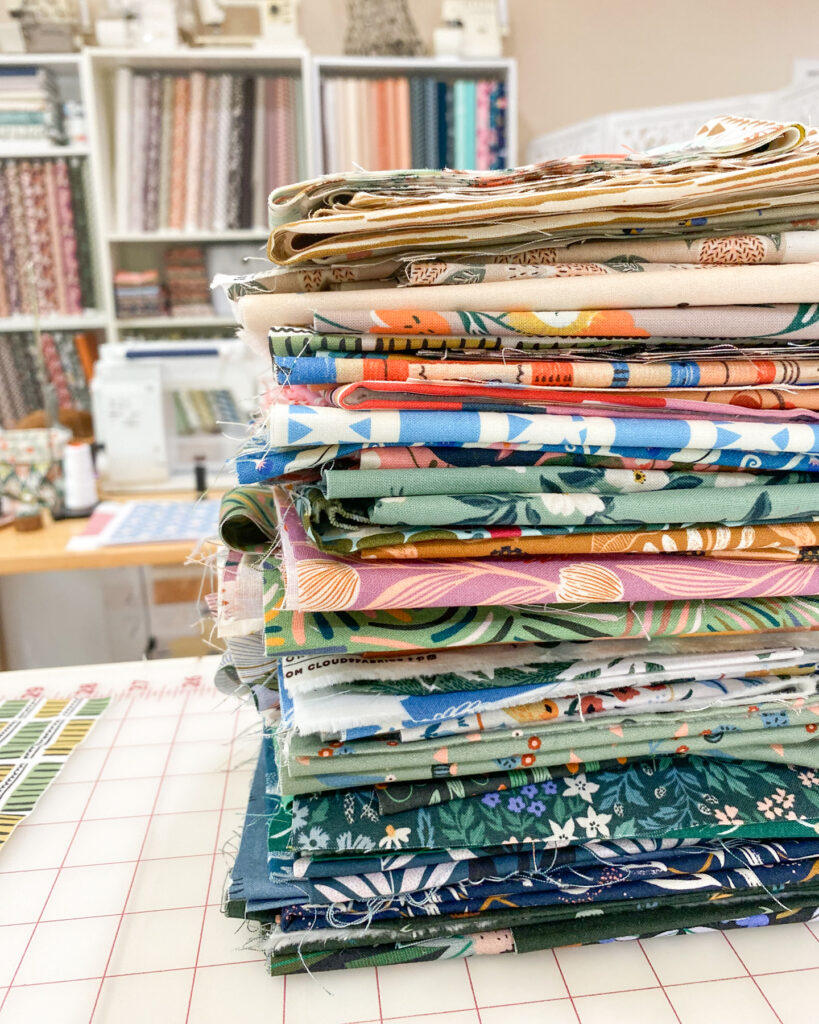 Scrappy fabric pull from quilt shop bundles for summer quilt projects