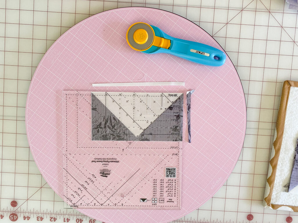 Trim #2 using Creative Grids Ultimate Flying Geese ruler for 3x6 units