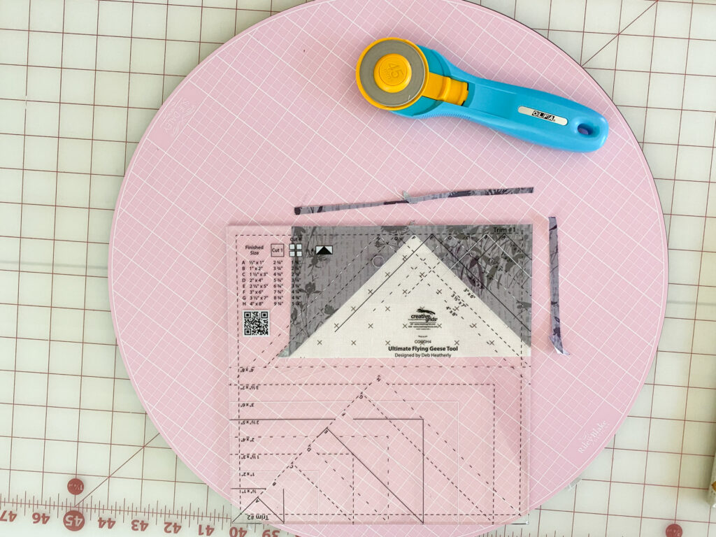 Creative Grids Flying Geese ruler positioned for Trim #1
