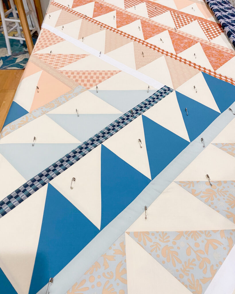 Pin basting a twin size quilt