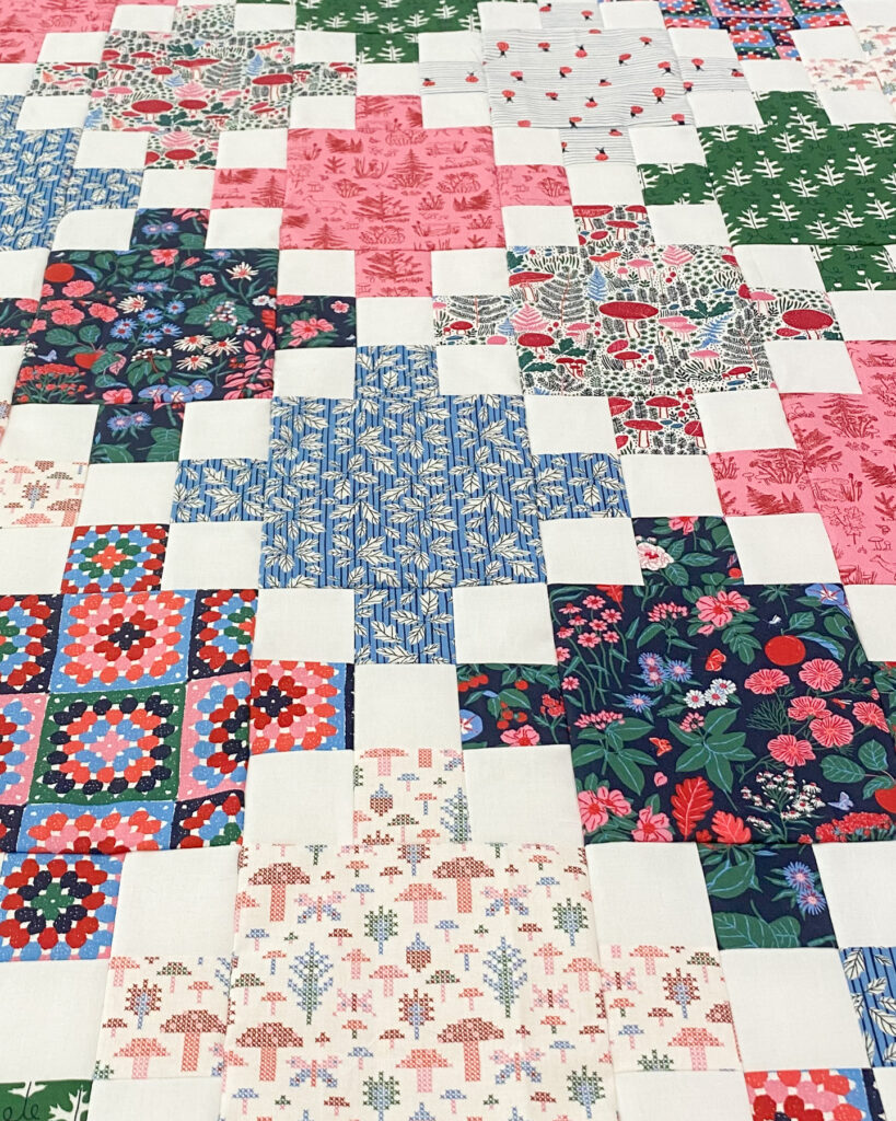 Multi color Single Irish Chain quilt made with Autumn Walk fabric collection by Cloud9 fabrics.
