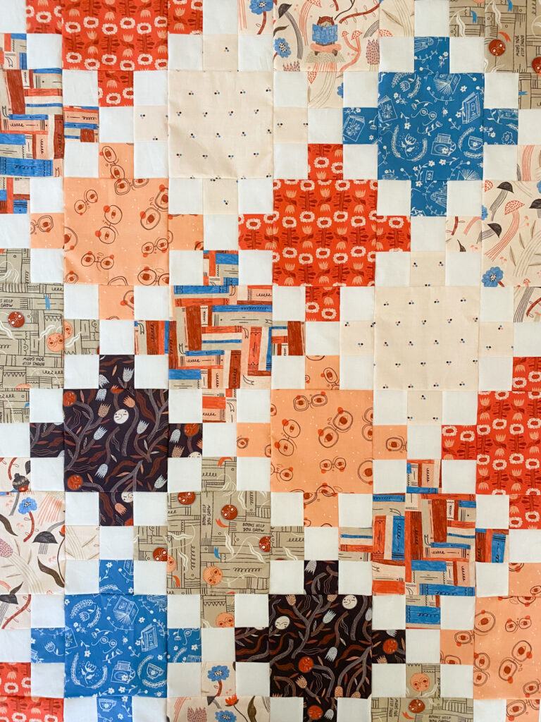 Multi color Single Irish Chain quilt made with Book Club fabric collection by Cloud9 fabrics.