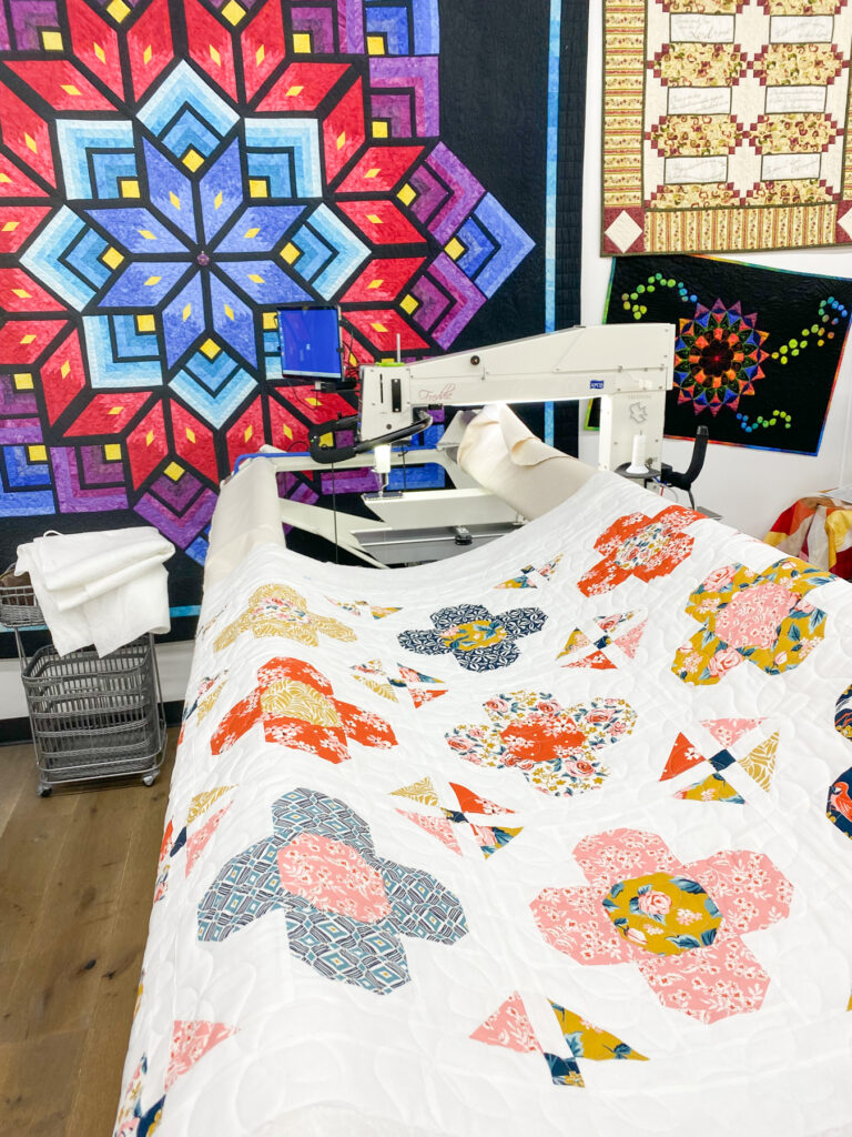 Longarm quilting Gem Blossom quilt with the Triplet pantograph at APQS