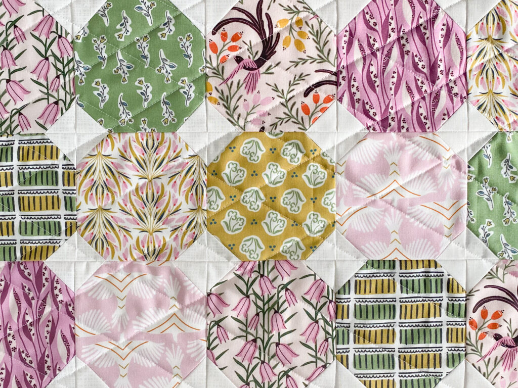 Diamond quilting pattern created by straight line quilting on pillow top